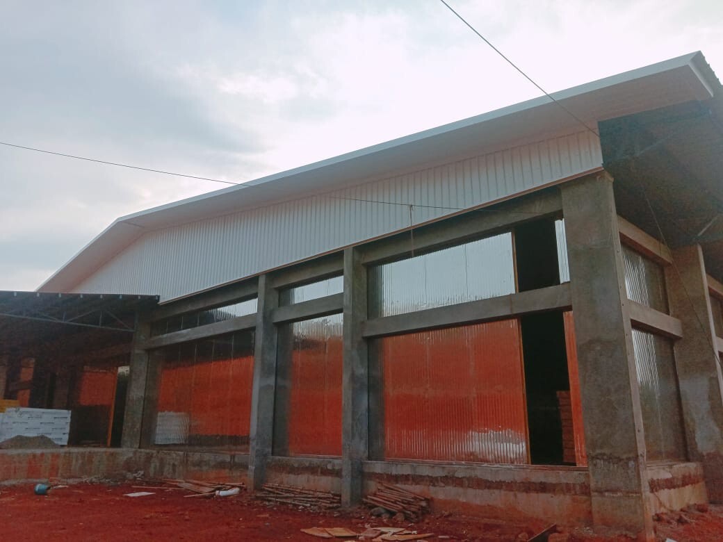 Commercial architectural roofing at Oberoi Mall, Mumbai: Specialized Kliplok roof-on-roof installation by Rishonn & Reyansh for leak-proof retail infrastructure.